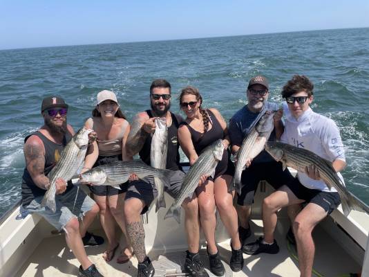 Charter crew holding fresh catch